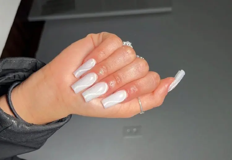 white long nails reflecting glitter very trendy christmas manicure 2022