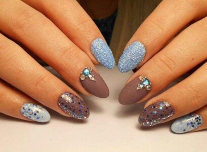 winter glitter manicure baby blue gray and blue glitter ot almond shaped nails