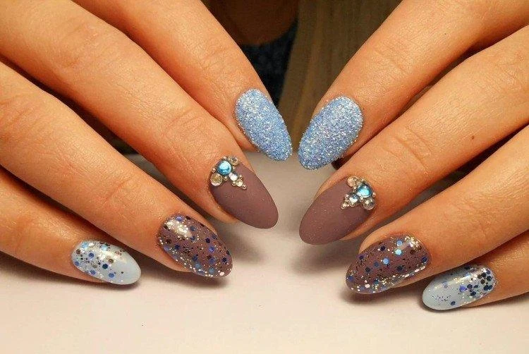 winter glitter manicure baby blue gray and blue glitter ot almond shaped nails