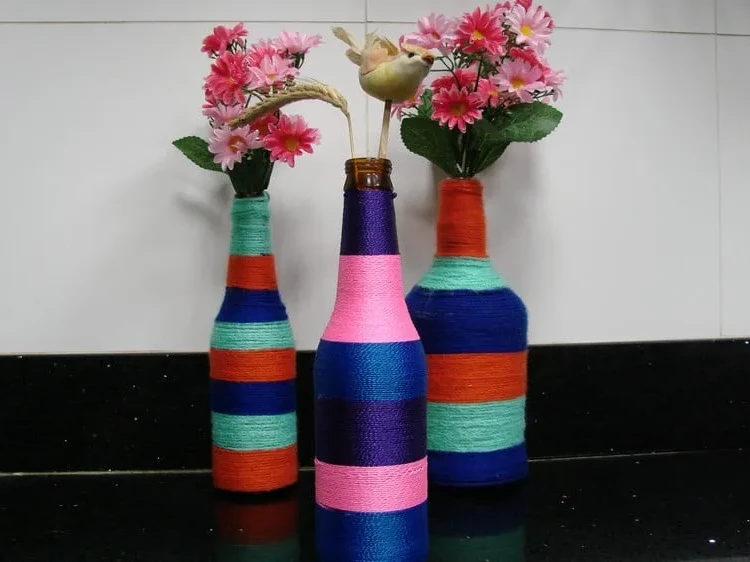 Festive decoration with wine bottles DIY colorful vases
