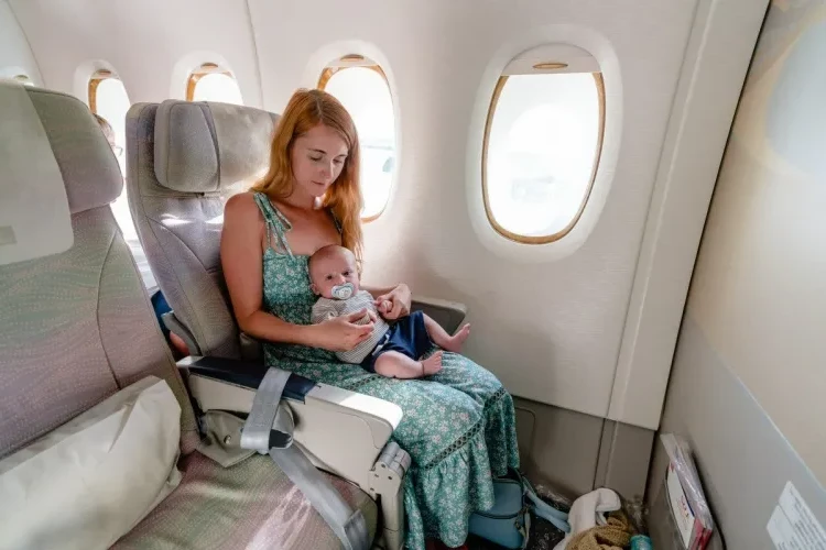 How to travel with a baby on a plane green light pediatrician buy ticket sitting on knees