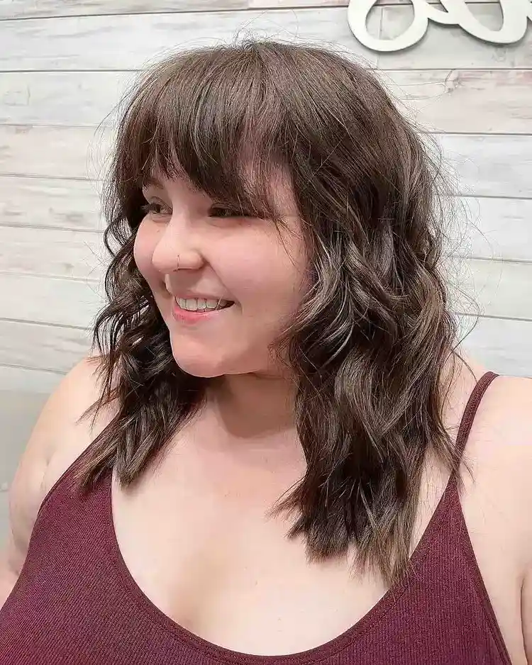 Shoulder-length-layered-cut-with-waves-and-bangs