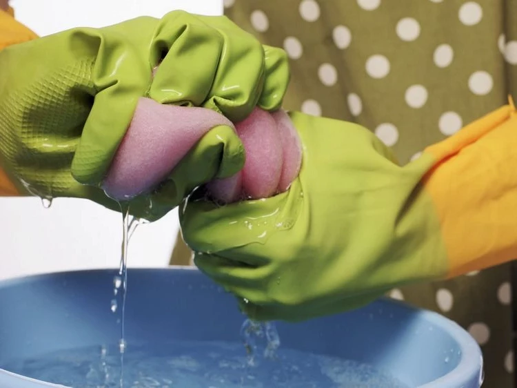 Which surfaces and materials should never be cleaned with water