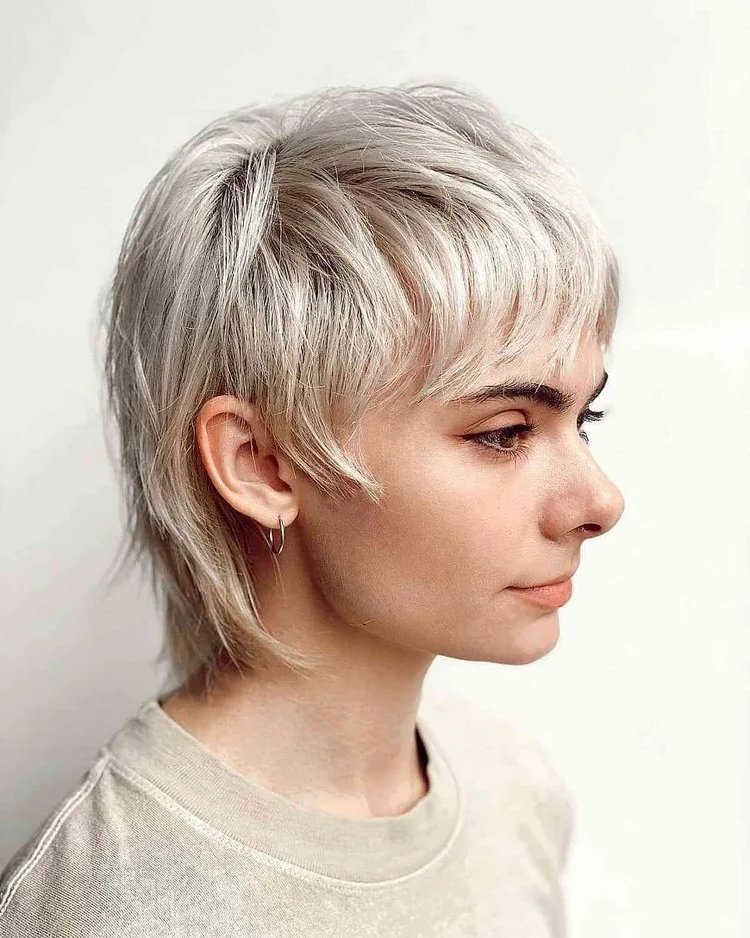With a light blonde shaved shullet hairstyle you are fully in trend