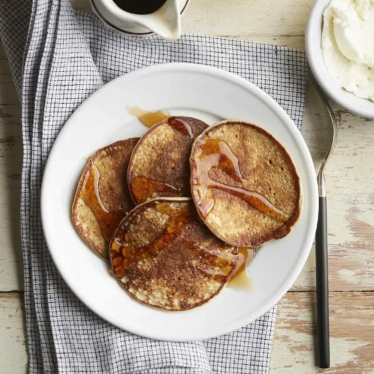 banana pancakes drizzled with maple syrup as a low carb breakfast for weight loss