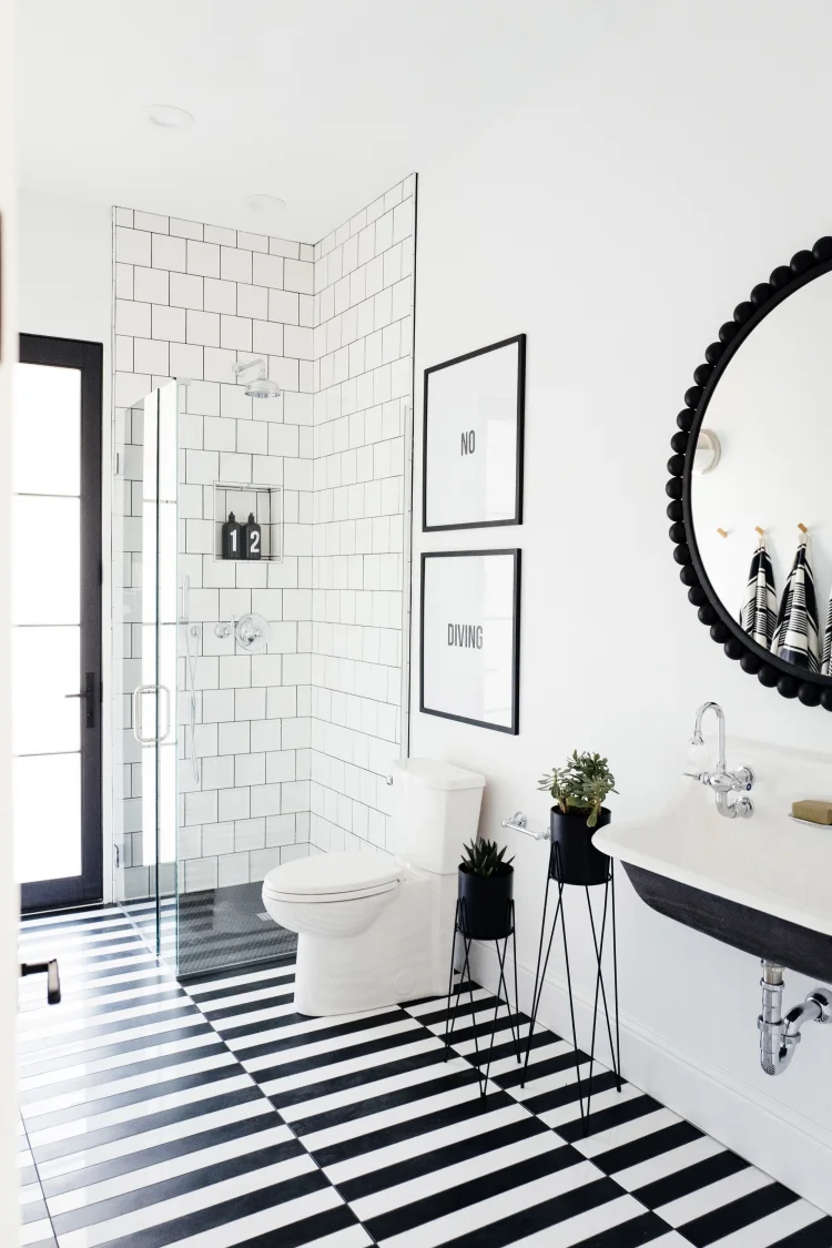 black and white bathroom frames artwork on walls black accents