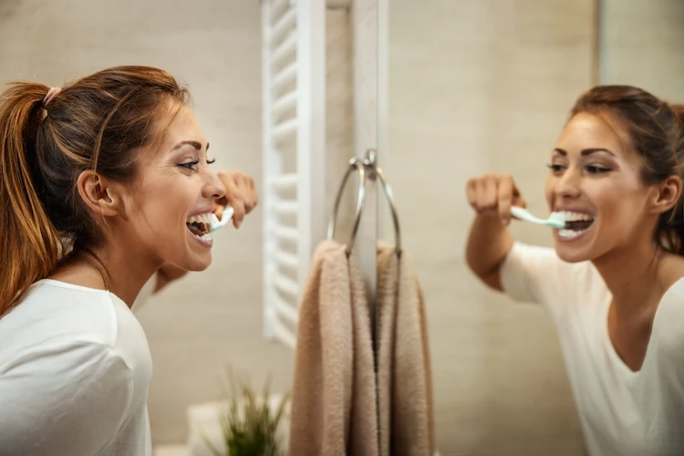 brush your teeth twice a day and prevent plaque buildup