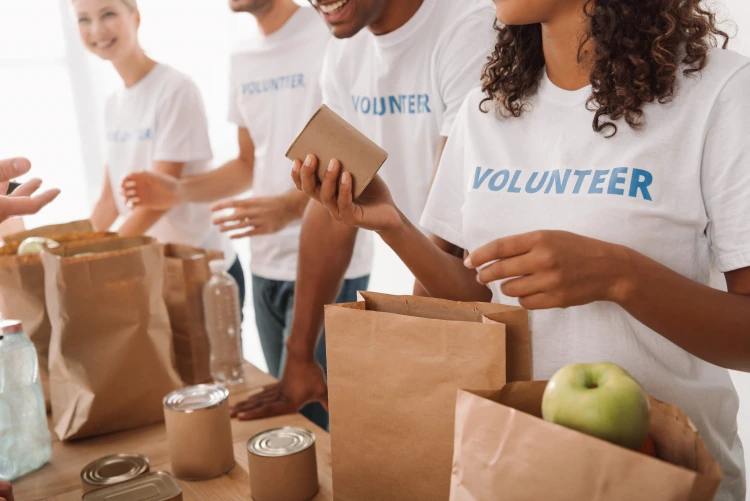 charity work volunteers helping other people positive deeds