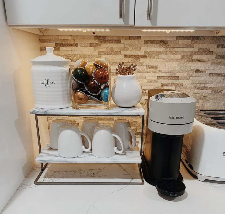 countertop used as a coffee station coffee machine canisters mugs