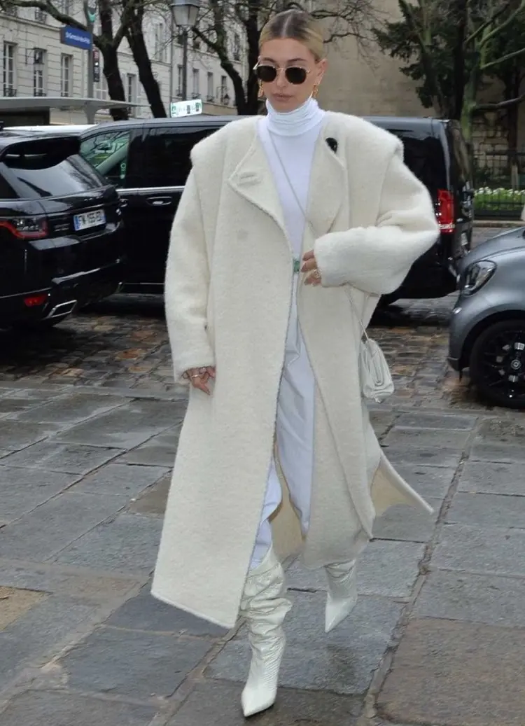 hailey bieber off white outfit with white boots and coat winter 2023 inspiration