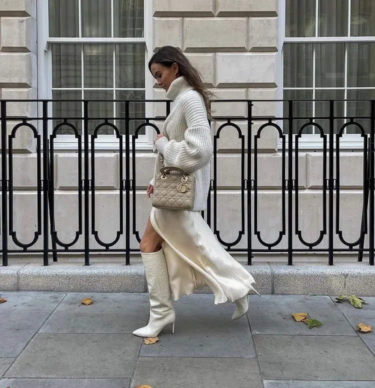 how to wear white boots outfit ideas inspiration white silk skirt knitwear winter 2023
