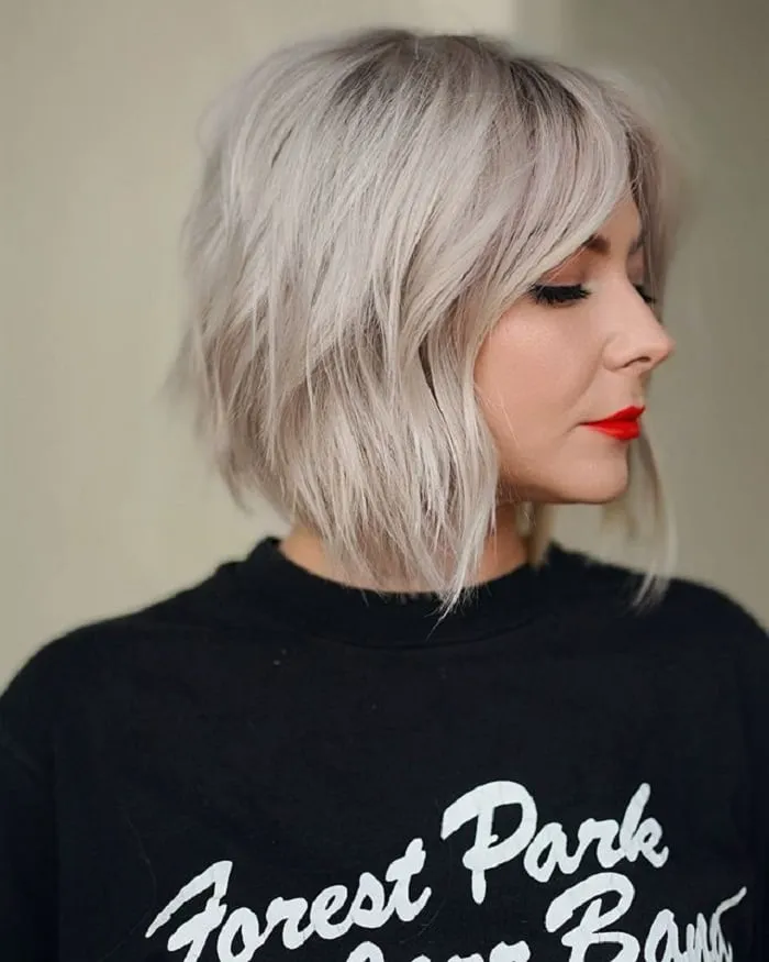 inverted bob with curtain bangs ash blond hair color