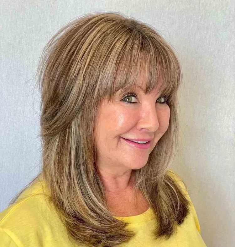 layered medium length hairstyles with bangs for women over 50