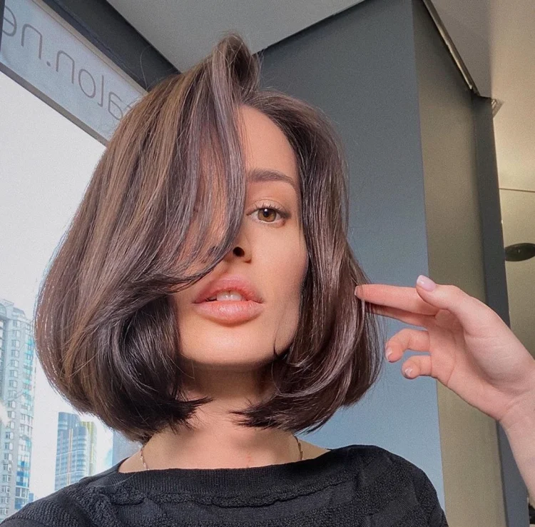 long asymmetrical bangs short hairstyle bob curled at the ends