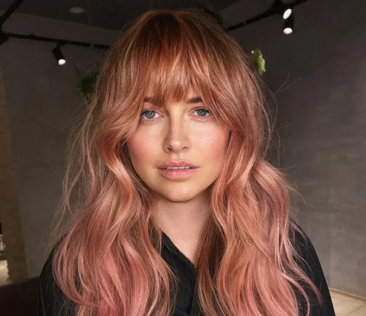 are bangs in style in 2023 long haircut with bangs peach hair color