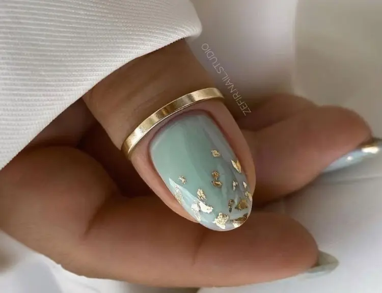 mint green and gold foil nail design elegant simple