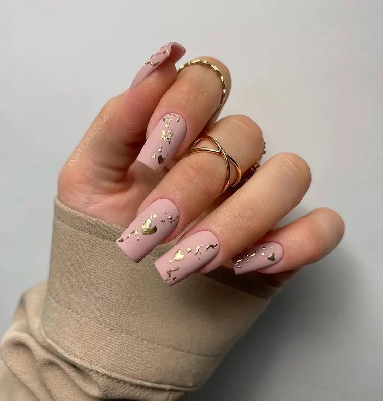 nude and gold chrome nails with decorations for valentines day