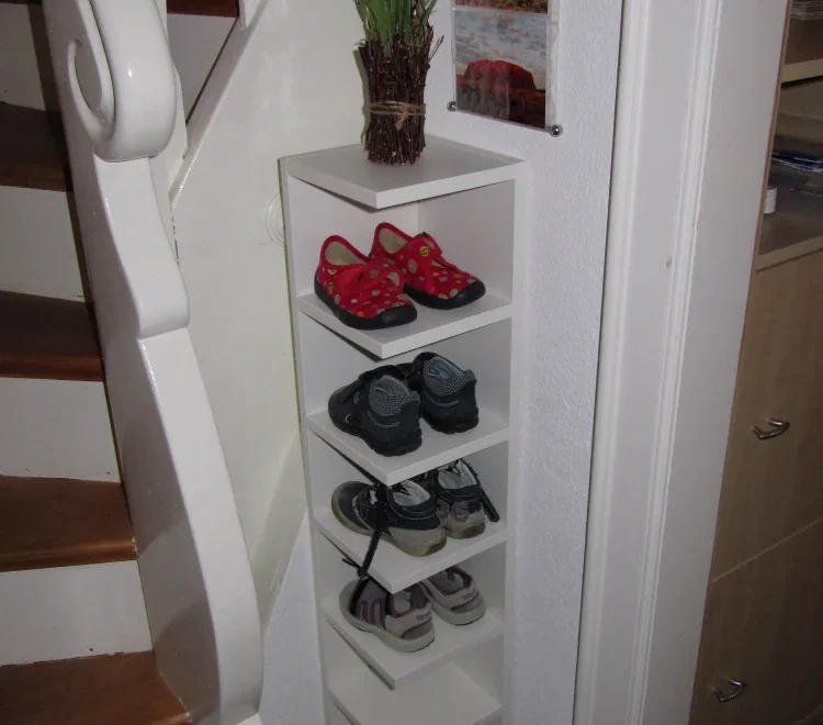saving space using corners at the house to built shelves for storing shoes