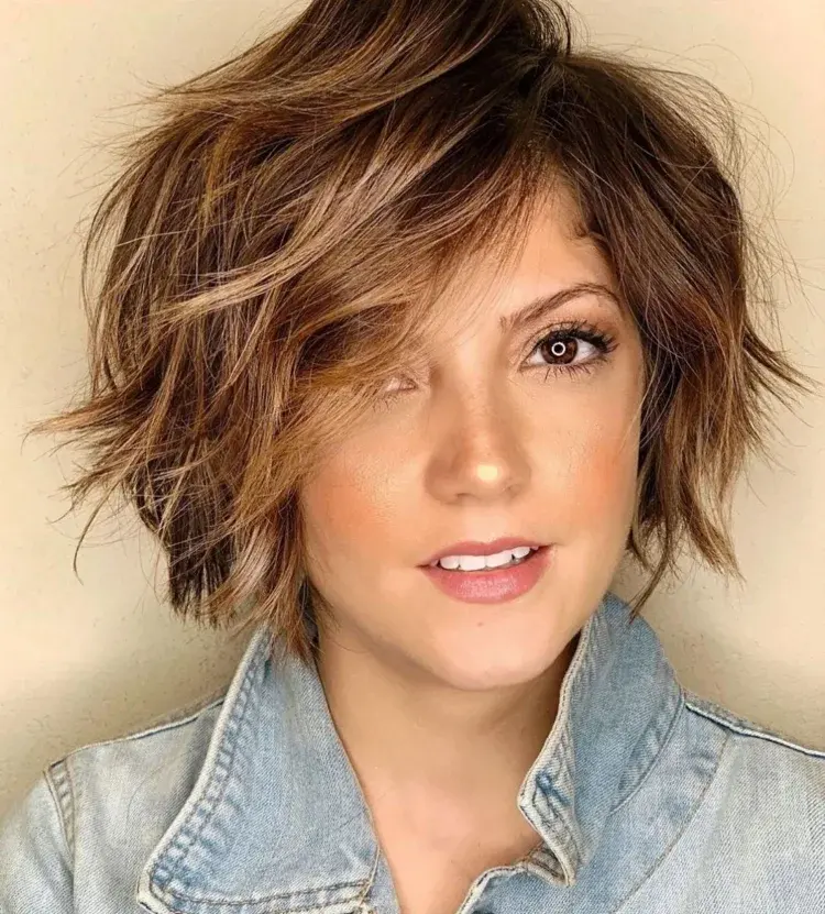 short shaggy haircut with side swept bangs highlights