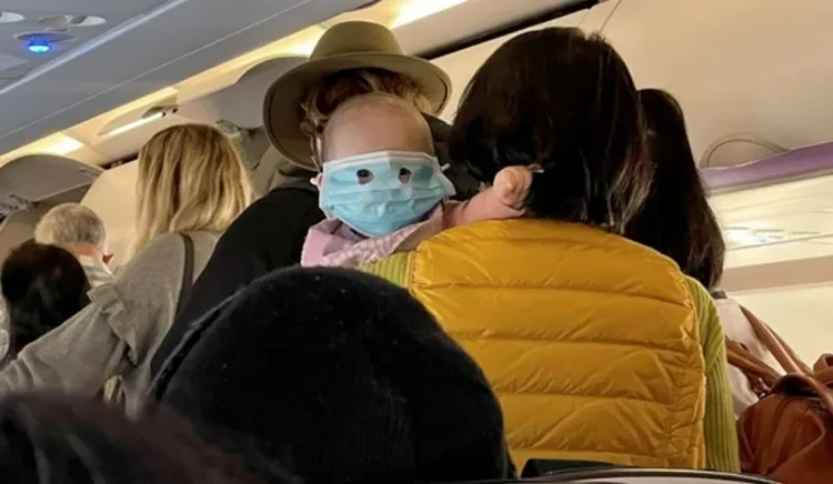 travel with a baby on a plane inform airline check restrictions age newborns