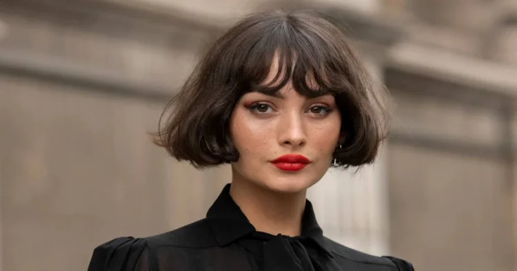 trendy French bob with thin blunt bangs romantic look