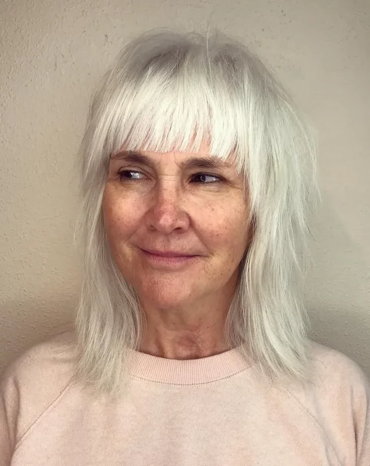 hairstyles women over 50 shag cut with bangs