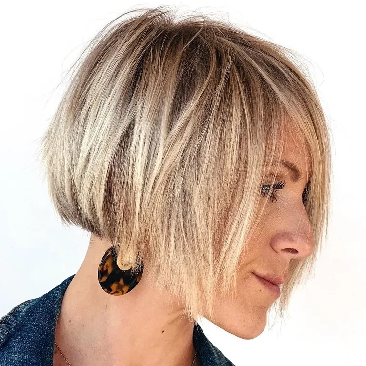 what short haircut at 50 years over 60 years old woman thick smooth blonde hair layered bob trend 2023