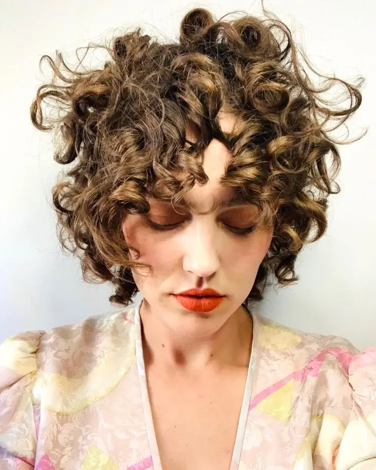 wild curly short haircut as a hairstyle trend french bob