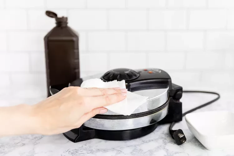 Clean the outside of waffle maker with gentle household remedies like baking soda and hydrogen peroxide