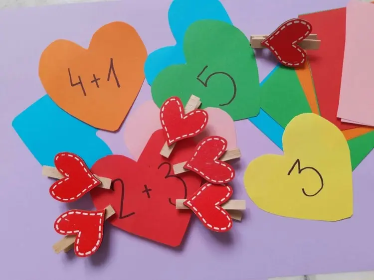 DIY Learning game with colorful hearts made of paper and felt