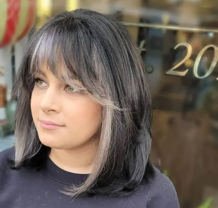 Gray lob with bangs and face framing light strands