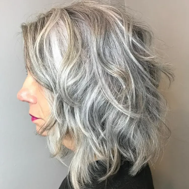 Shoulder length bob hairstyle with layers and gray tones