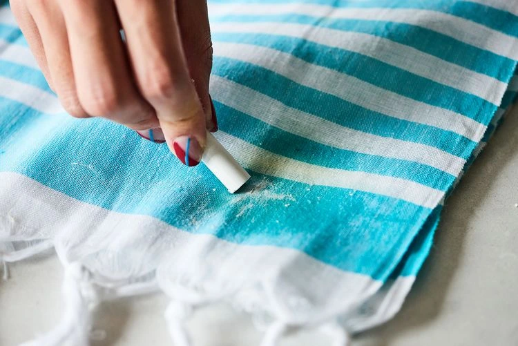 Use chalk to remove greasy stains from clothes