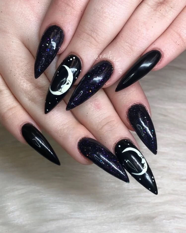 black stiletto nails with astrology nail art