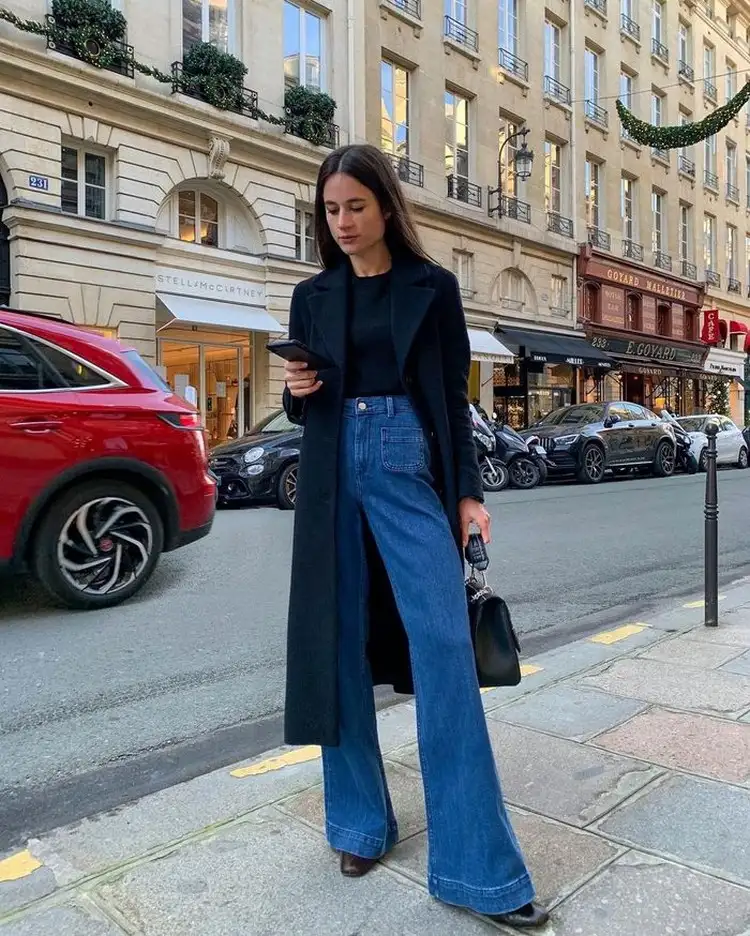 combine flared jeans with a long coat
