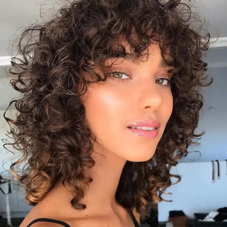 curly bob hairstyle with a fringe