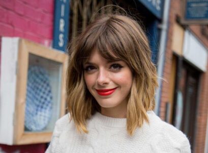 cute messy chunky bob with bangs and highlights
