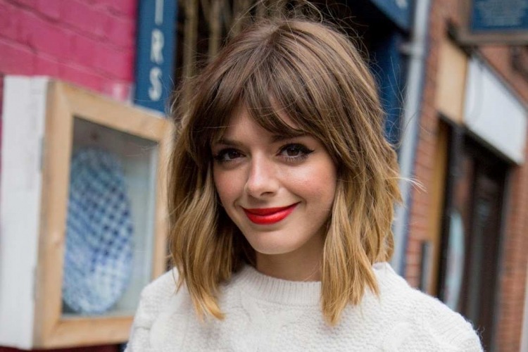 cute messy chunky bob with bangs and highlights