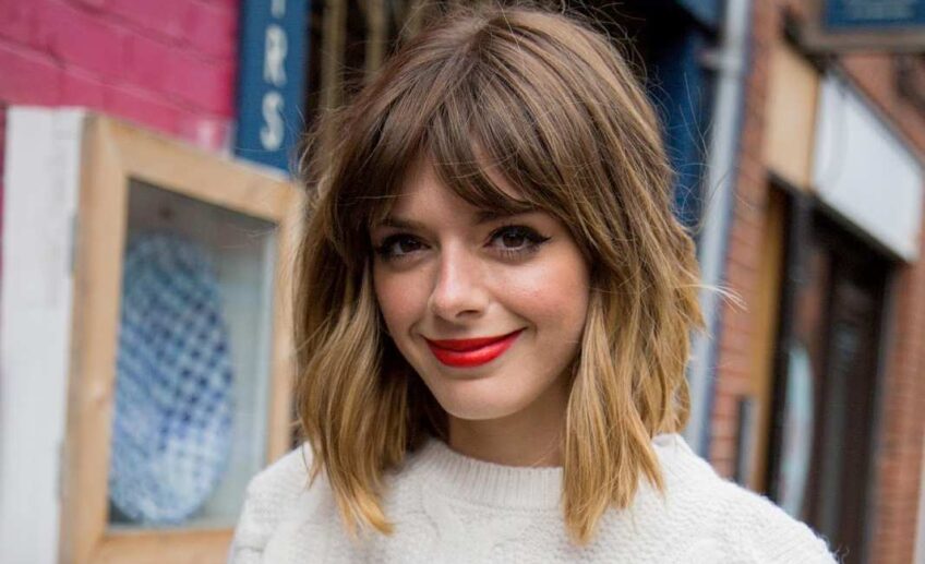 cute messy chunky bob with bangs and highlights