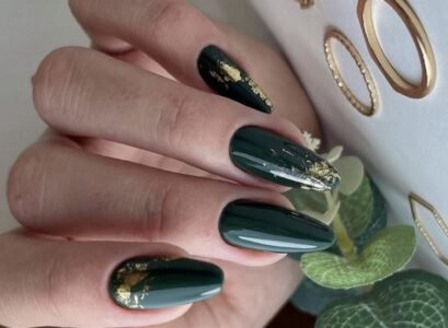 emerald green nails with gold decorations