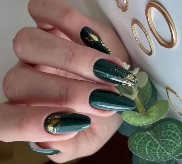 emerald green nails with gold decorations