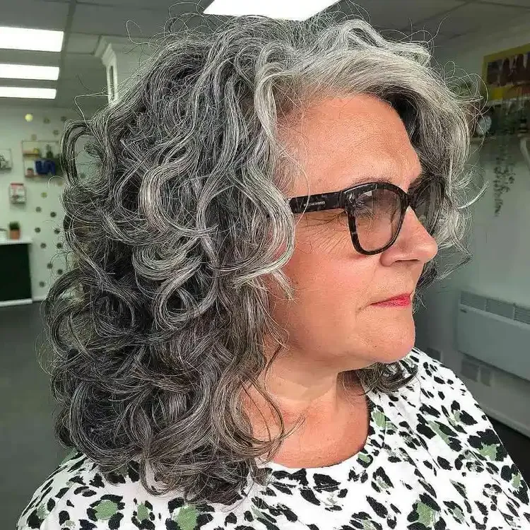 layered cut for curly mid-length hair over 60
