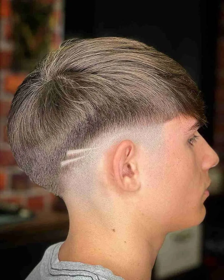 low-fade-with-shaved-lines-and-fringe-for-men-2023