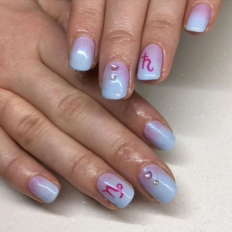 manicure according to the zodiac sign Capricorn blue and pink gradient rhinestones