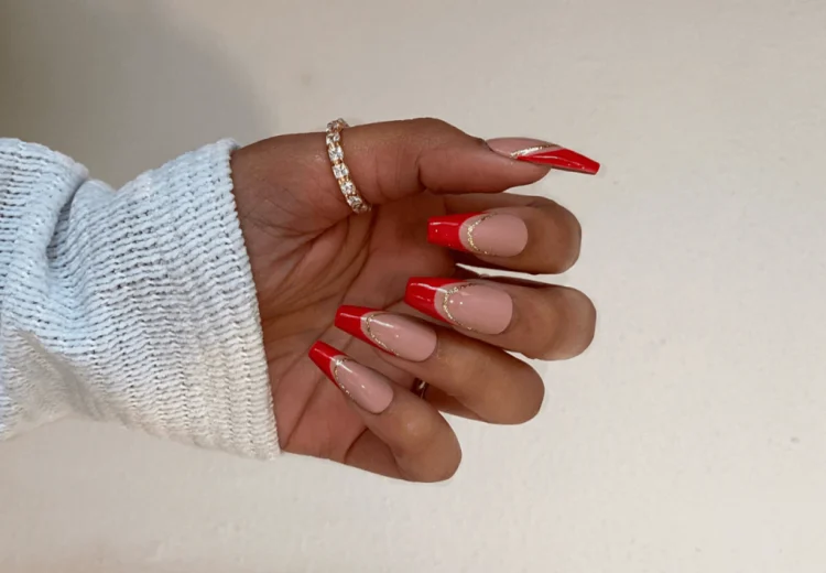 red manicure gold accents trend 2023