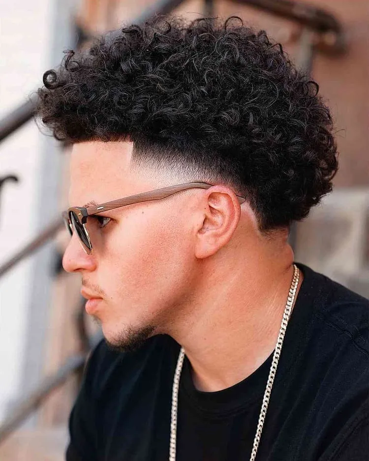 thick-curls-and-low-fade-men's-haircut-2023
