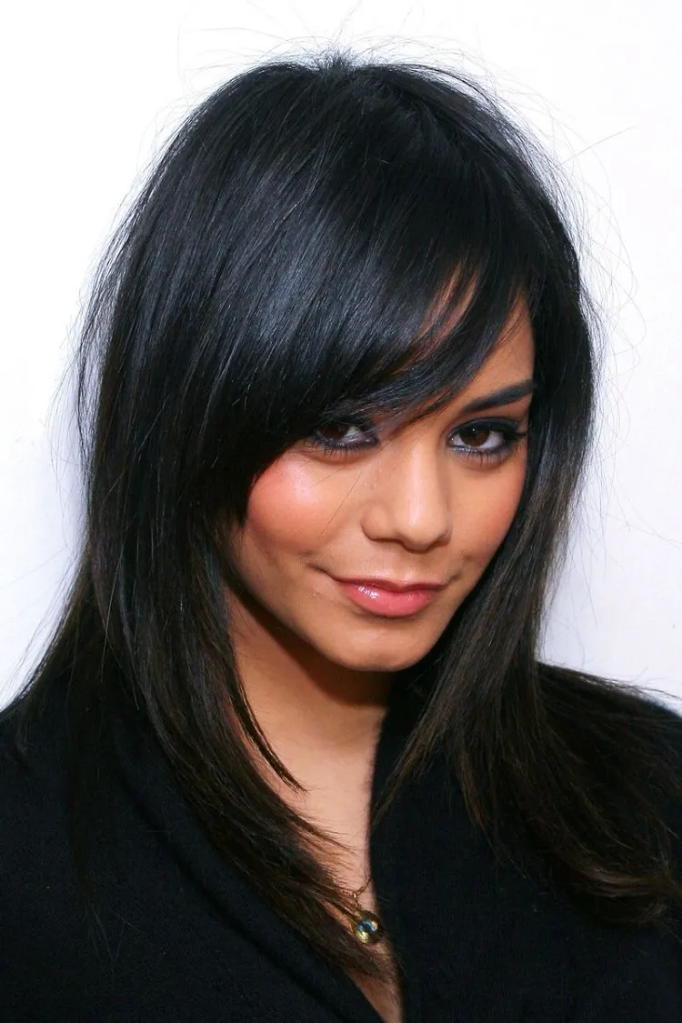long bangs hairstyles add a movement with layered bangs a lady