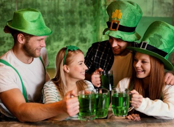 St. Patrick's Day dinner celebration with green beer and festive hats