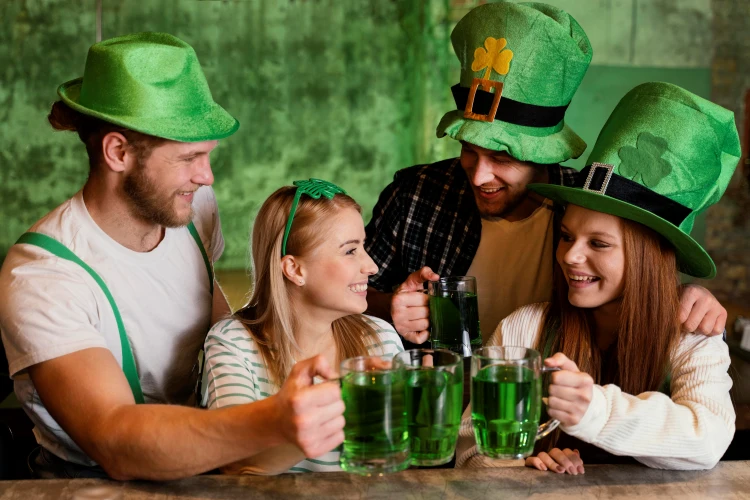 St. Patrick's Day dinner celebration with green beer and festive hats