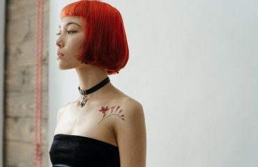 asian girl with french bob with bangs red hair